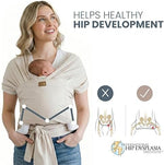 TAB PERFORMANCE ergonomic infant wrap carrier in beige fabric being adjusted