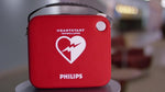 Portable Philips HeartStart AED stored in protective slim carry case