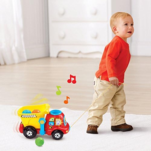 Hinged bucket on the yellow toddler truck unloading the educational rocks