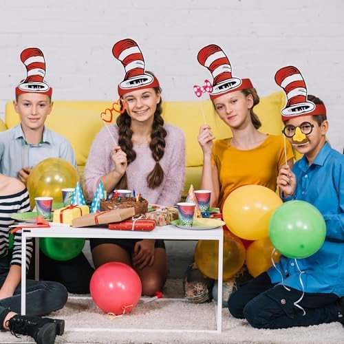 Wehhbtye white and red striped paper hats party setup