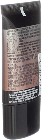 Applying liquid highlighter to cheekbones
