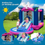 Children playing in Honey Joy bouncy castle with slide