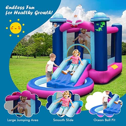 Children playing in Honey Joy bouncy castle with slide