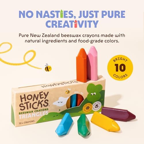 Ergonomic triangle shape non toxic crayons held by a toddler for pencil grip development