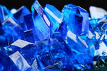 Close up of bright blue copper sulfate pentahydrate crystals