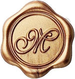 Close up of Yoption gold M wax seal sticker on envelope