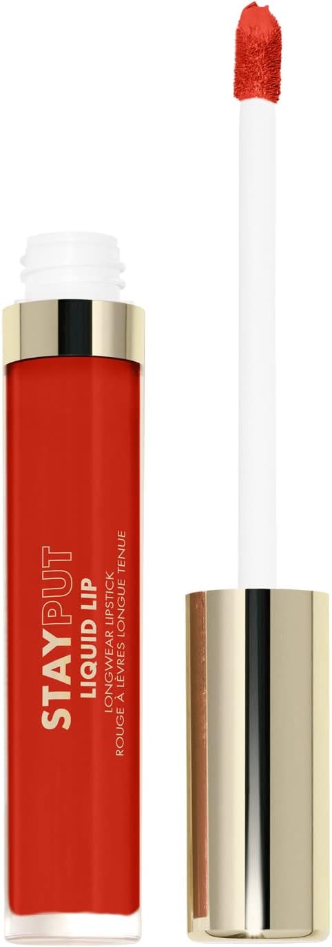 Milani Stay Put Matte Lipstick swatch of the bold red shade That Girl on skin