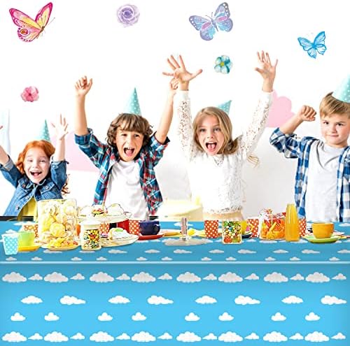 Three blue sky and cloud patterned party tablecloths folded