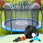 Fine water mist spraying from the multi-head rotating nozzle over an outdoor backyard play setup