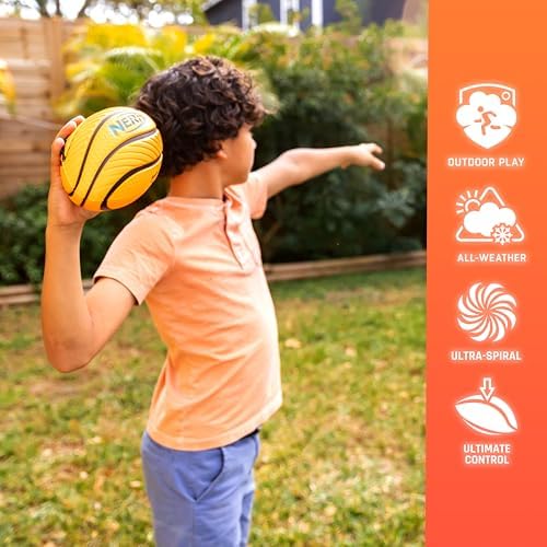 Durable Nerf spiral grip mini football resting on an outdoor grass playground surface