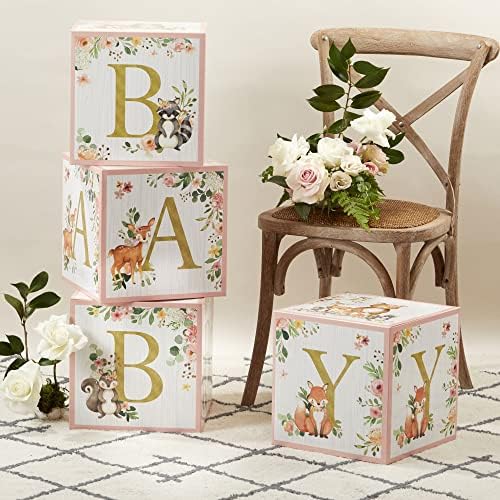 Pink woodland baby boxes used as a nursery decor prop