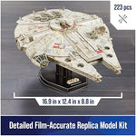 4D Build Millennium Falcon model kit displaying punch-out cardstock sheets and included assembly glue.