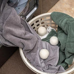 Ecoigy wool balls showing XL size comparison for efficient drying.