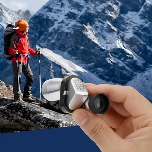 Portable handheld mini monocular pocket telescope for adults being held to demonstrate compact size