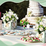 Decorative baby shower flower boxes on a table setting