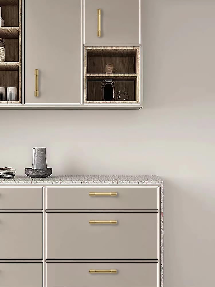 Kitchen cabinet hardware mounted on a wooden drawer.