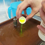 Novacan glass tool accessory bottle highlighting the eighty ounce fluid capacity formulation.