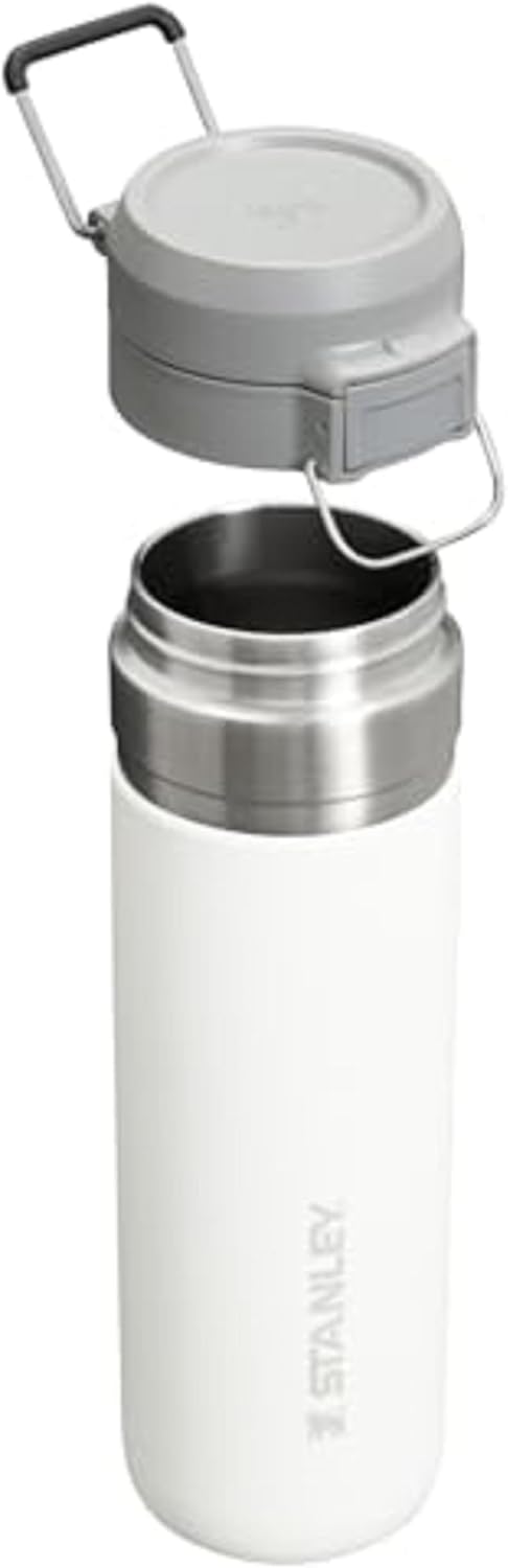 Stanley insulated stainless steel travel bottle showing the push button lid mechanism