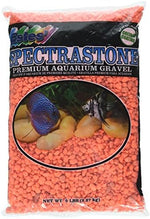 Vibrant orange neon aquarium gravel close up texture