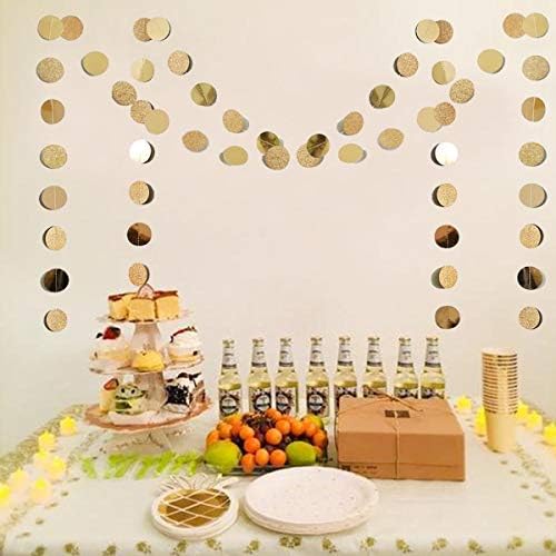 Pre strung champagne gold circle paper banner draped over a birthday party table setup