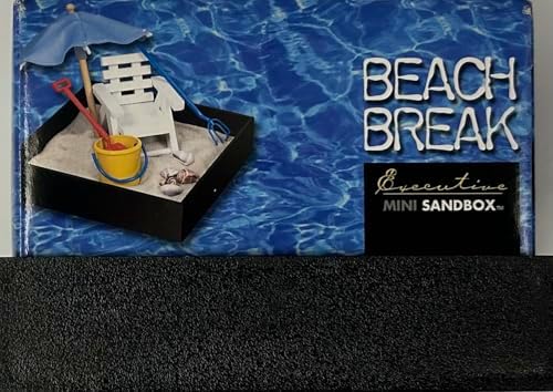 Lifestyle shot of the executive mini sandbox placed on an office table next to a laptop for workplace stress relief.