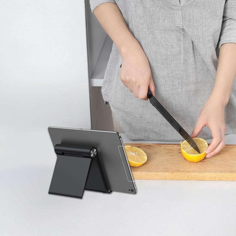 Generic black adjustable tech accessory supporting a large smartphone during a video call