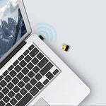 TP-Link USB WiFi adapter size comparison next to a coin
