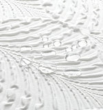 Reinforced top header with rust proof metal grommets on the Gibelle white fabric shower curtain.