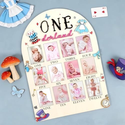 HarpandTimbrel Alice in Wonderland themed first birthday milestone sign displayed on a decorative celebration table.