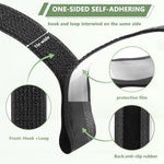 Heavy duty black hook and loop tape bundle securing messy electrical cords behind a desk