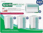 Close up of GUM dental picks showing soft rubber bristles for plaque removal.