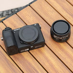 Close up of the rear lens cap replacing the Sony ALC-R1EM model to safeguard electronic contacts.