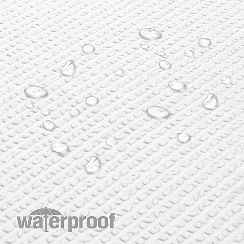 Water droplets quickly forming beads and rolling off the water-repellent polyester fabric surface.