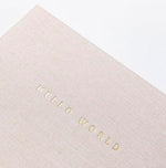 Open pages of the luxury 160 GSM paper baby journal illustrating milestone writing prompts