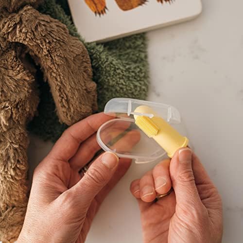 Adult finger wearing Dr. Brown's silicone brush demonstrating dual-sided texture.