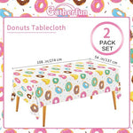 Close-up view of the colorful sprinkle and donut pattern on the Gatherfun plastic table cover