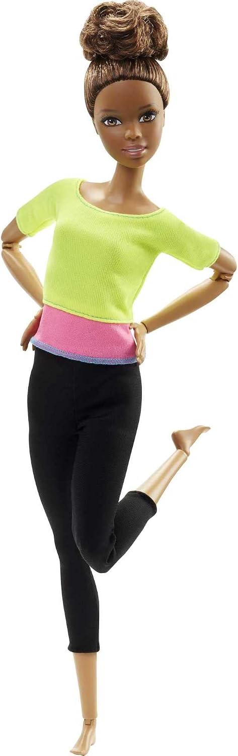 Barbie Made to Move fashion doll front view showing green color-blocked top and brown hair.