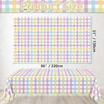 Hegbolke rainbow checkered disposable table cover spread over a long rectangular party dining setup.