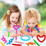 Close up view of multicolored retractable sensory plastic tubes stretched out to produce clicking sounds