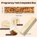Sliding lid mechanism open on the natural wood baby announcement box with raffia.