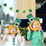 St Patricks Day beaded garland styled as a festive backdrop hanging on an indoor home bar wall.