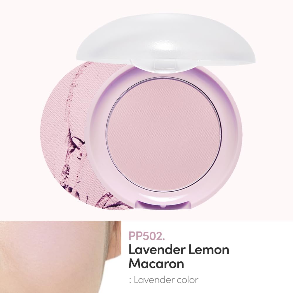 Close up view of the signature bow adorned cushion puff inside the Etude House makeup compact.