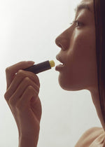 Henné Organics Luxury Lip Balm V2 size comparison in hand