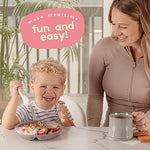 Child using ChériKid suction plate for self feeding