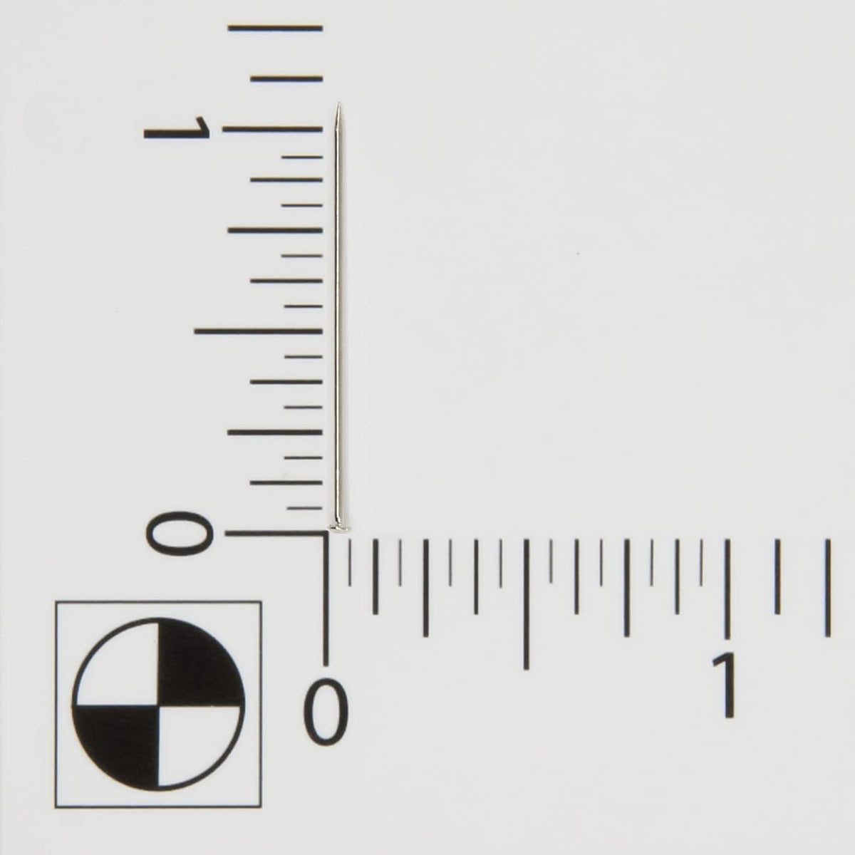 Close up of the 1-1/16 inch nickel-plated steel sewing pins inside the curved storage container.