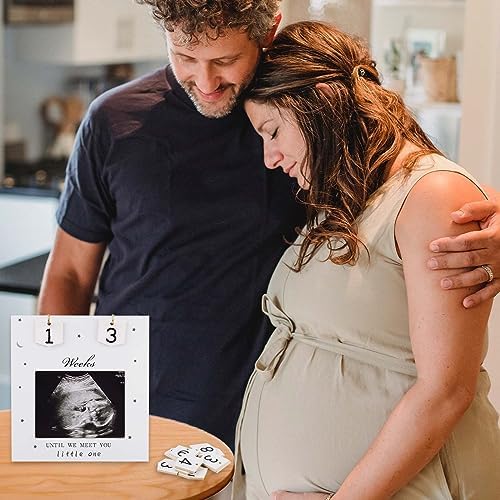 NQEUEPN gender neutral baby countdown frame placed as a decoration piece in a modern living room