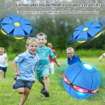 Parent and child playing catch with the blue transforming ball outdoors