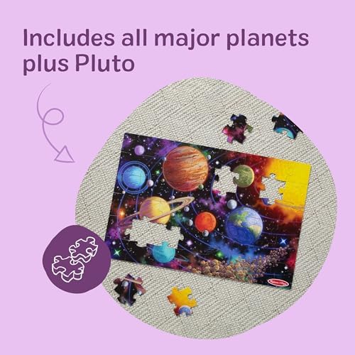 The included illustrated planet guide and multilingual reference insert resting next to the Melissa And Doug box.