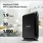 Angled view of Netgear AC1900 dual band Wi-Fi router highlighting vertical status indicator lights.