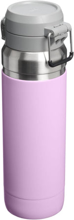 Stanley Quick Flip GO 36 ounce hydration bottle being opened with one hand showcasing the travel friendly design.